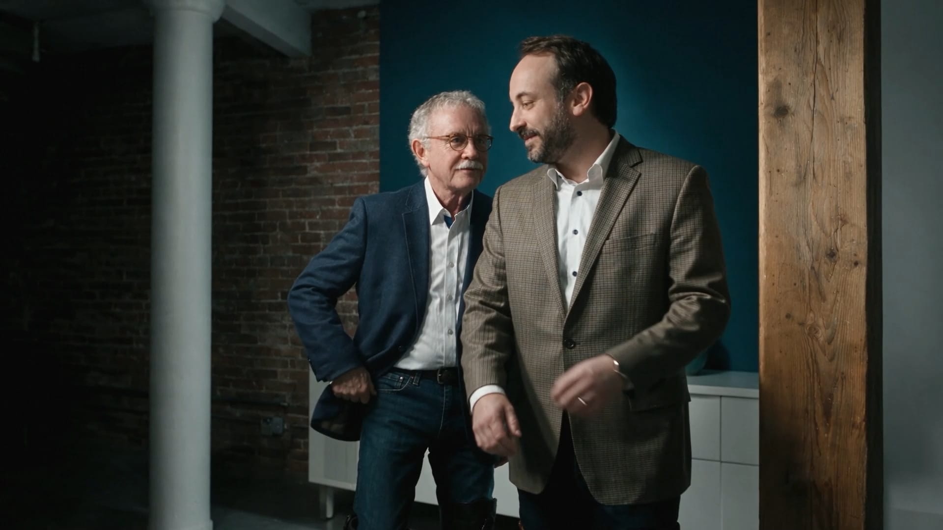 Dr. Robert G. Anderson and Dr. M. Anthony Daniels standing together in a loft-style office with exposed brick and timber