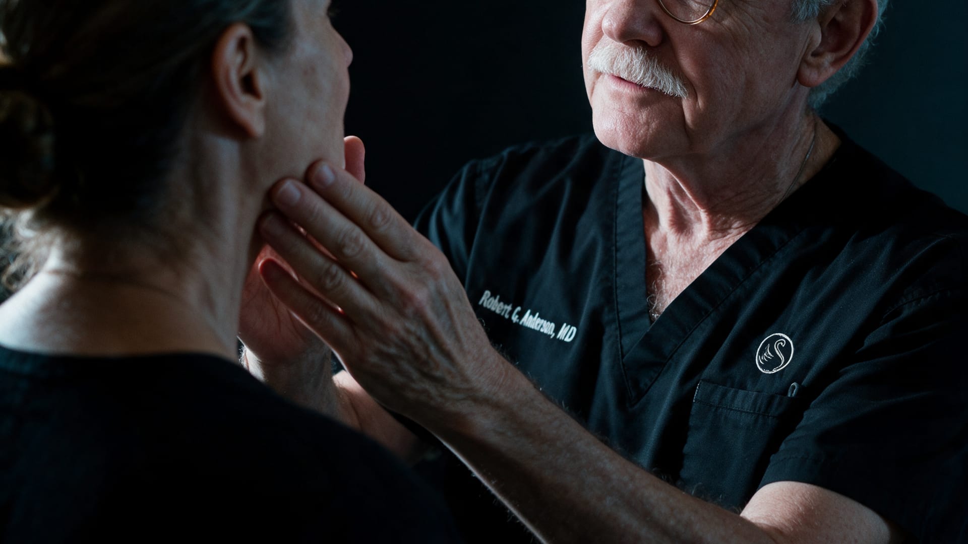 Dr. Robert G. Anderson in consultation with a patient